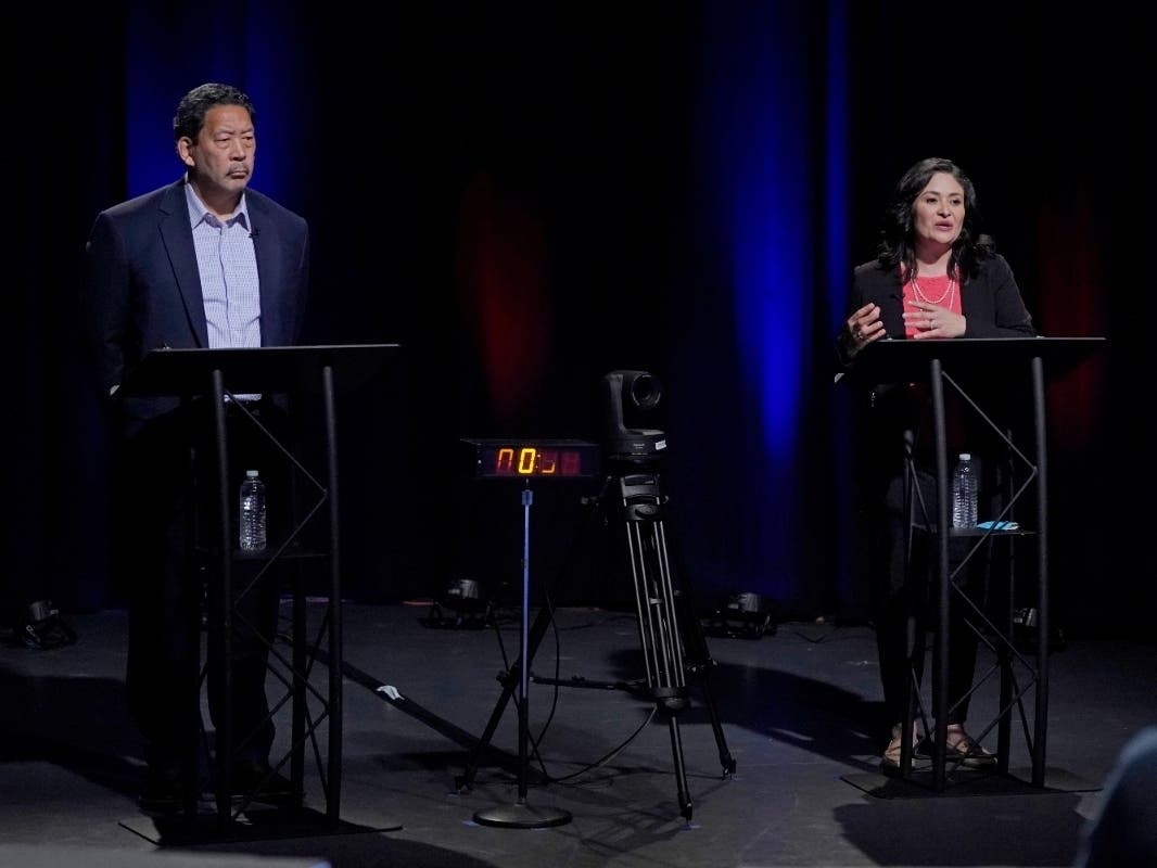 In this Oct. 14, 2021, file photo, Bruce Harrell, left, and Lorena Gonzalez take part in a Seattle mayoral debate.