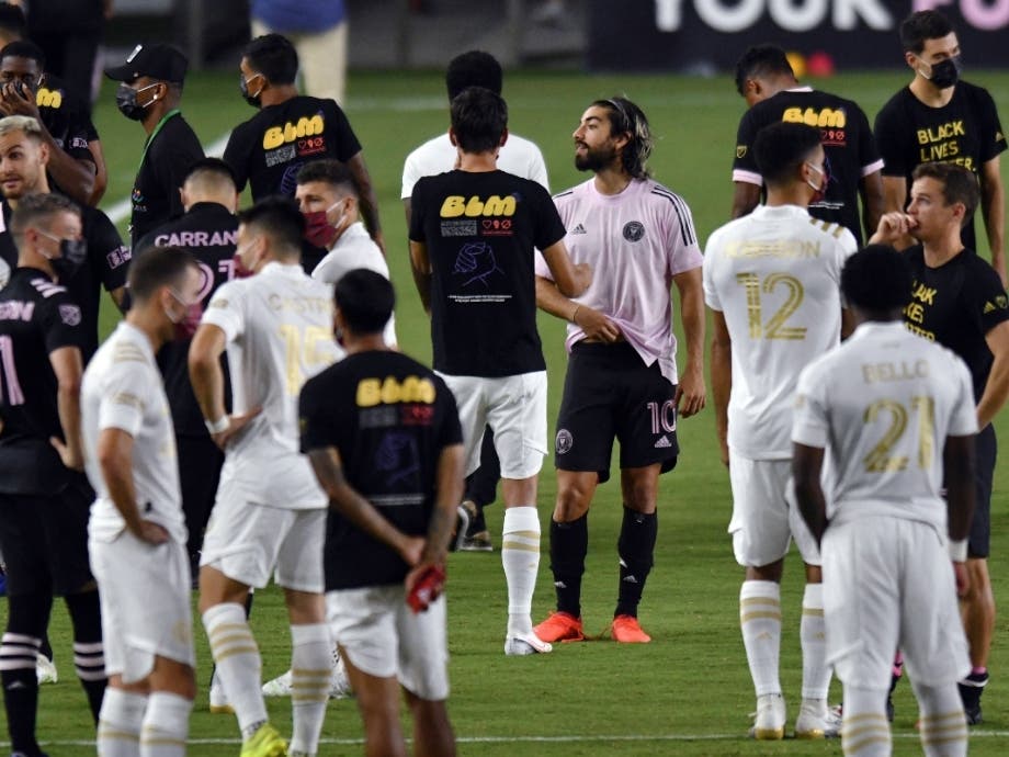 Players from Inter Miami and Atlanta United gather on the field before a scheduled MLS soccer match, Wednesday, Aug. 26. Soccer players boycotted five games Wednesday night in a collective statement against racial injustice.