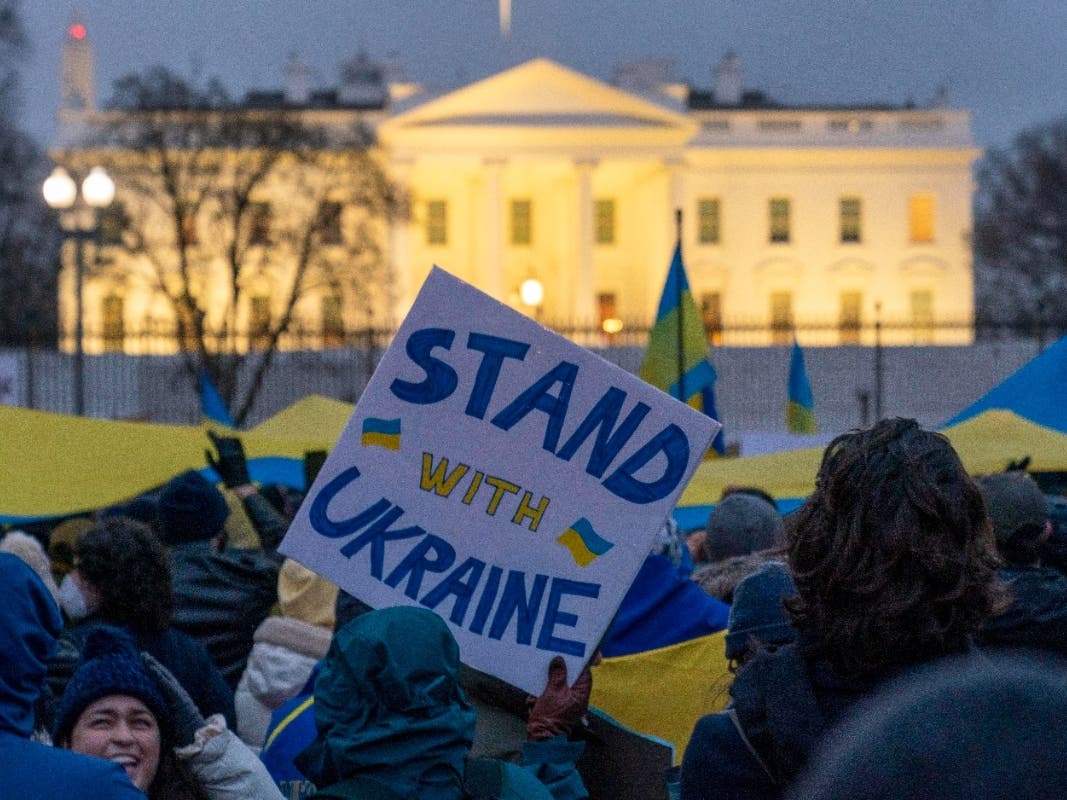 People take part in a vigil to protest the Russian invasion of Ukraine in front of the White House in Washington, Thursday, Feb. 24, 2022. 
