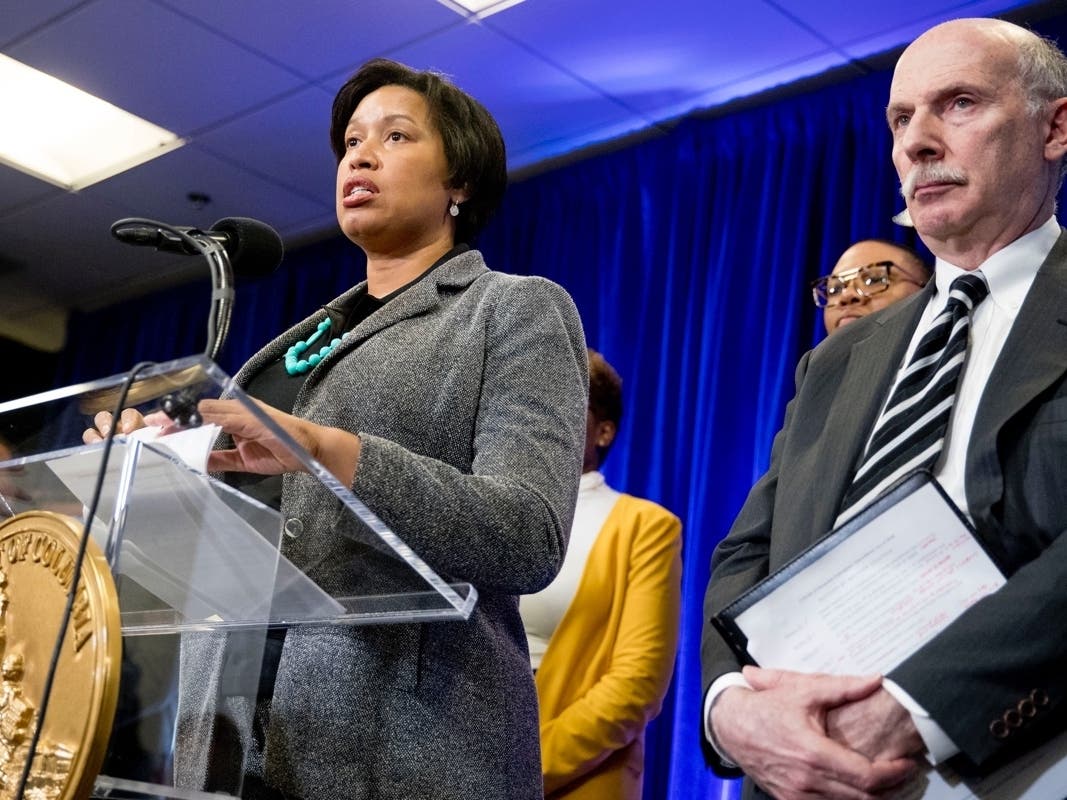 Mayor Muriel Bowser and Council Chairman Phil Mendelson speak at a coronavirus press conference. All District bars and restaurants must halt table seating.