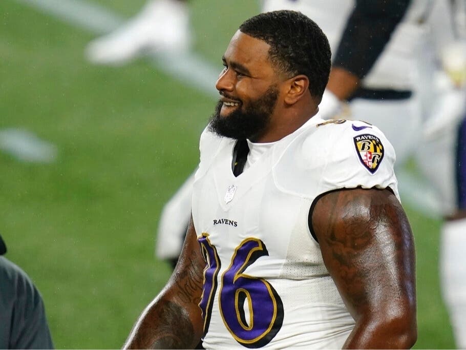 Baltimore Ravens defensive tackle Broderick Washington warms up before an NFL football game against the New England Patriots, Sunday, Nov. 15, 2020, in Foxborough, Mass.