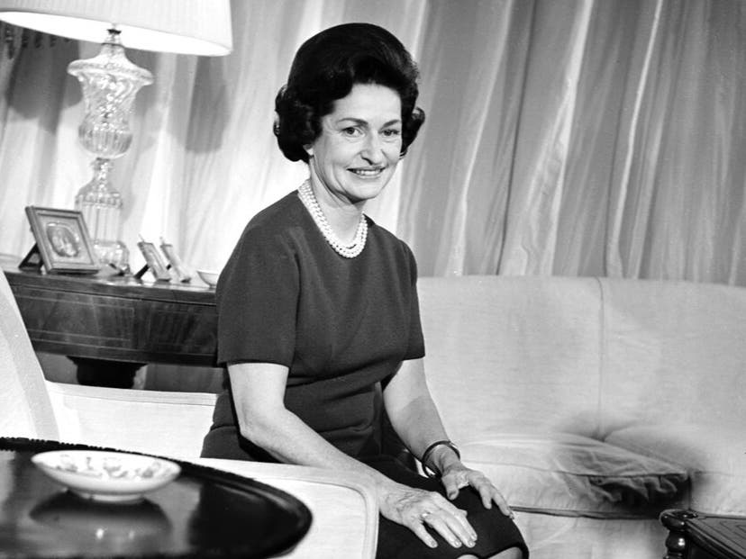 Lady Bird Johnson poses for a birthday portrait in a family sitting room in the second floor residence of the White House in Washington, D.C., Dec. 21, 1963. 