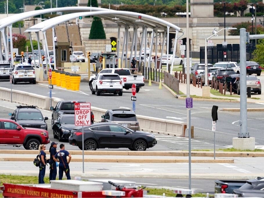 Emergency vehicles are seen outside the Pentagon Metro area Tuesday, Aug. 3, 2021, at the Pentagon in Washington. The Pentagon is on lockdown after multiple gunshots were fired near a platform by the facility's Metro station.