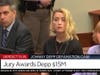 In this screen grab from video, Amber Heard, right, reacts as the verdict is read in the courtroom in the Fairfax County Circuit Courthouse in Fairfax, Va., Wednesday.