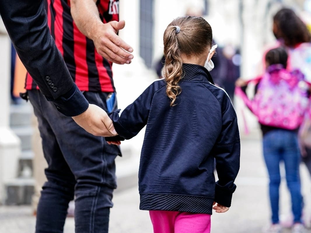 Students arrive for in-person classes outside a New York City school on Tuesday.