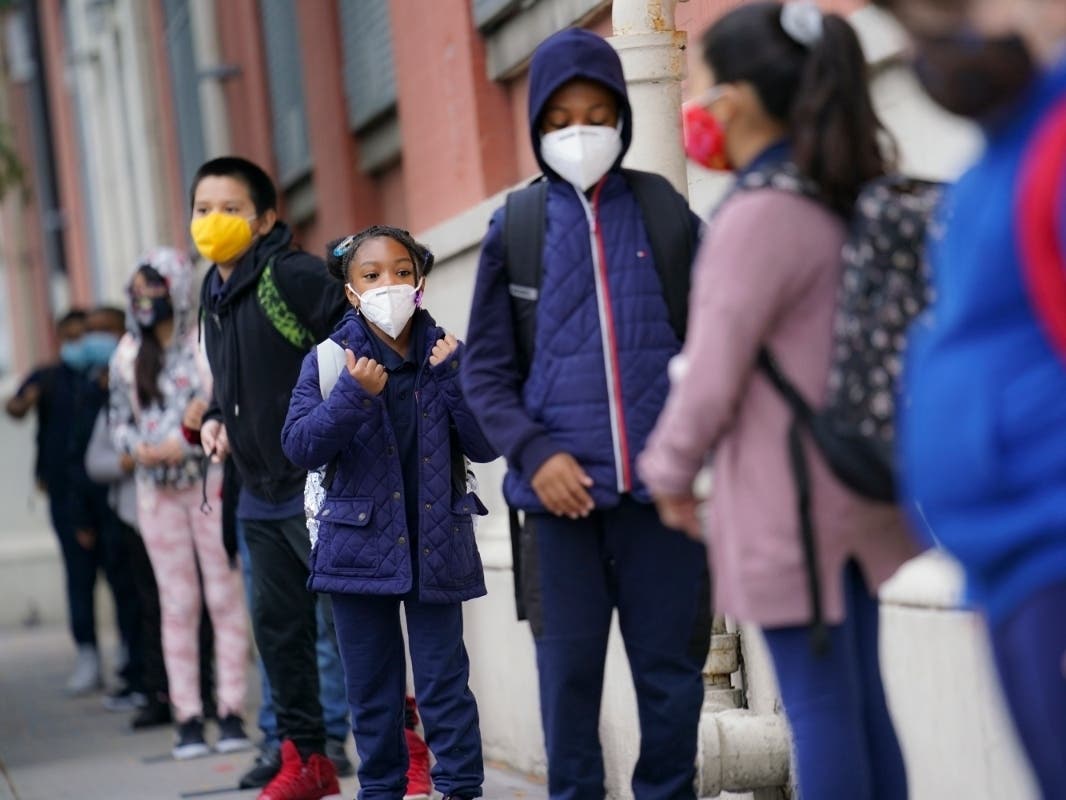 Students arrive for in-person classes outside Public School 188 in New York on Sept. 29.