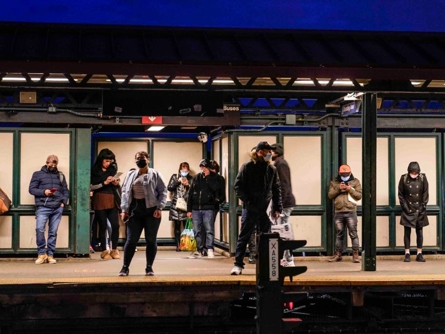 Rider wait for a Metropolitan Transportation Authority subway train at the 74th street subway station in Queens on April 22.