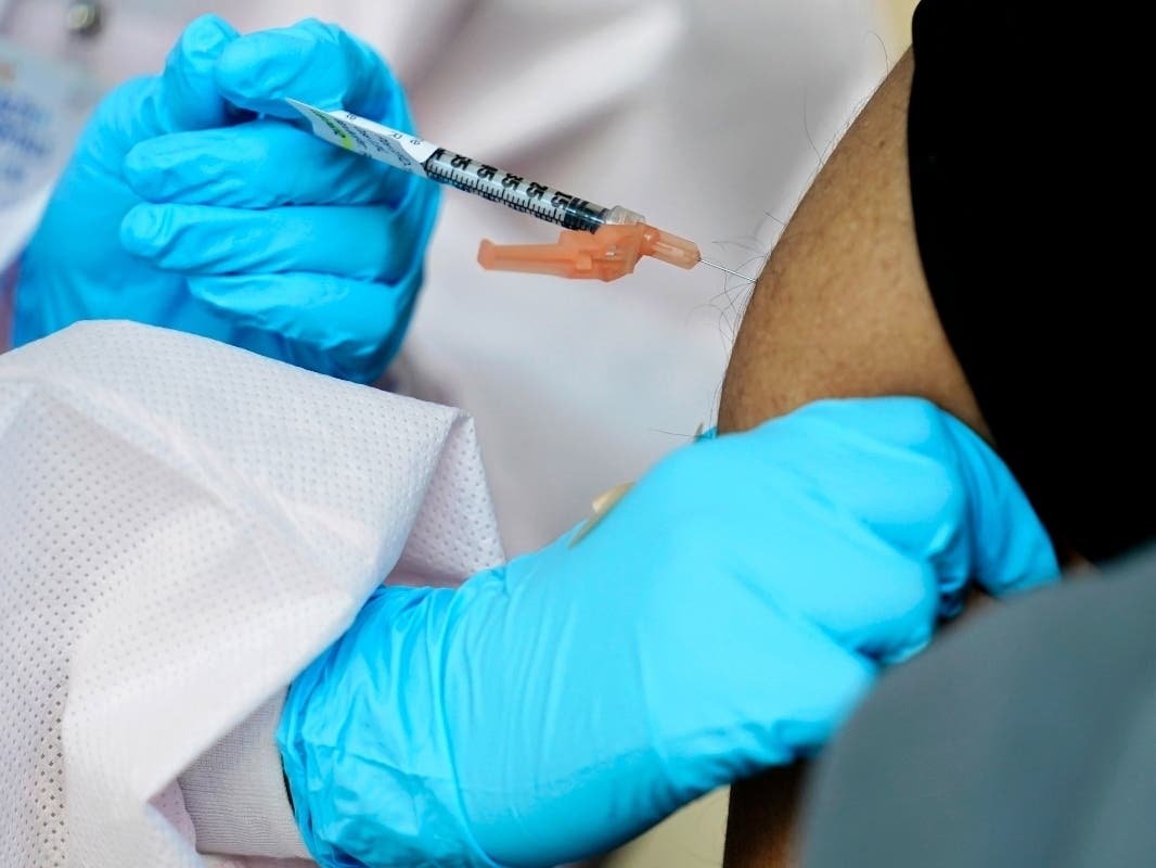 A man receives a COVID-19 vaccine in the Harlem section of New York on Feb. 25.