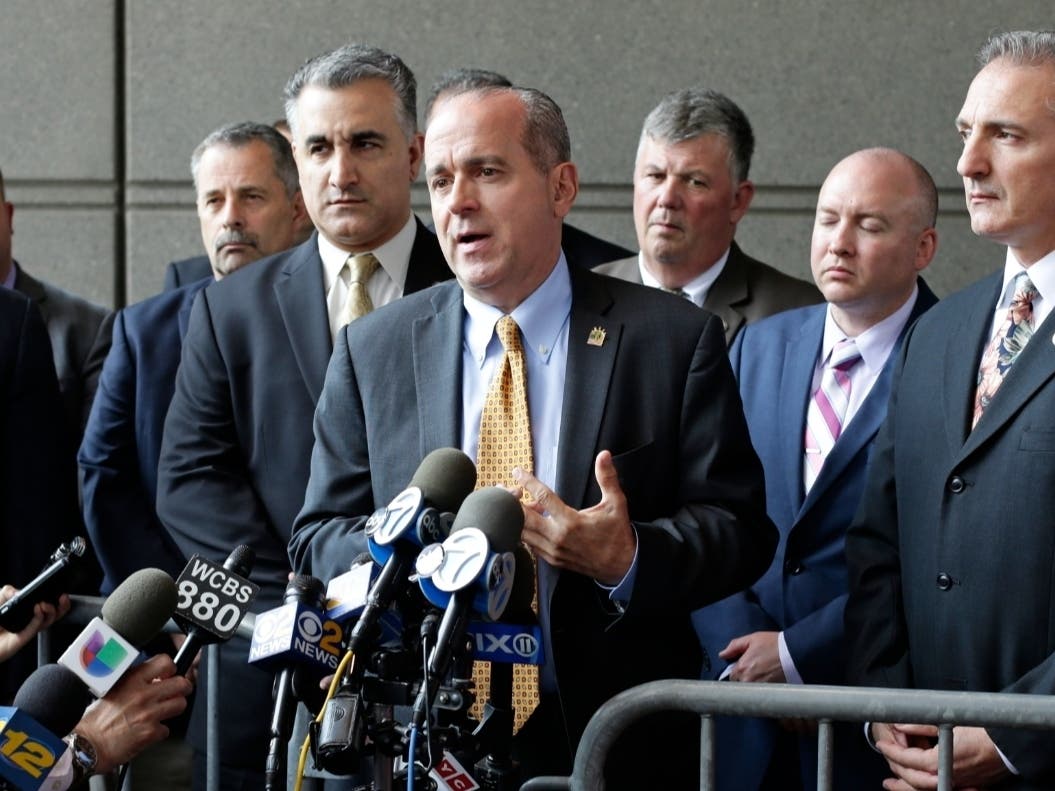 Sgt. Ed Mullins, the head of the Sergeants Benevolent Association, center, speaks to the media outside of the Bronx Supreme Court after a police sergeant was by a grand jury on a murder charge on May 31, 2017.