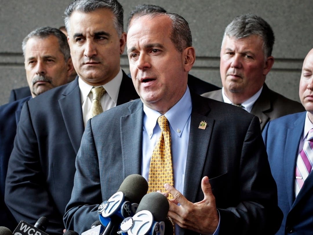 Former NYPD Sgt. Ed Mullins, center, head of the Sergeants Benevolent Association, speaks during a news conference in the Bronx on May 31, 2017.