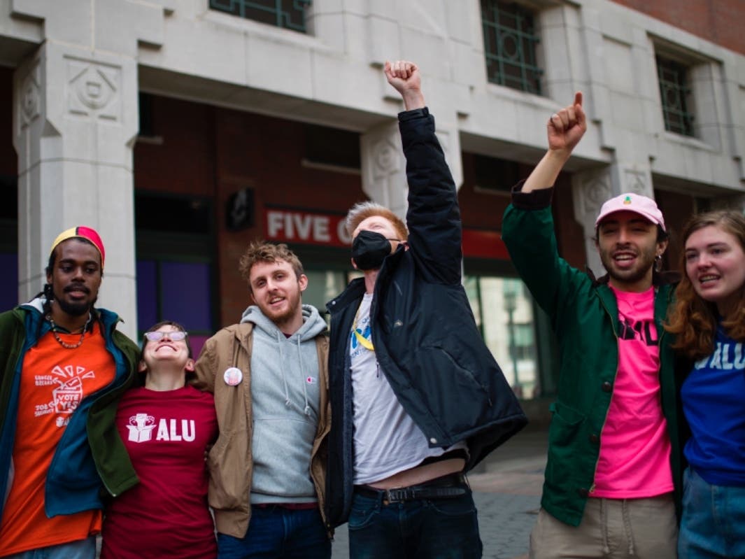 Amazon Labor Union members celebrate after an update during the voting results to unionize Amazon warehouse in Staten Island on Friday.