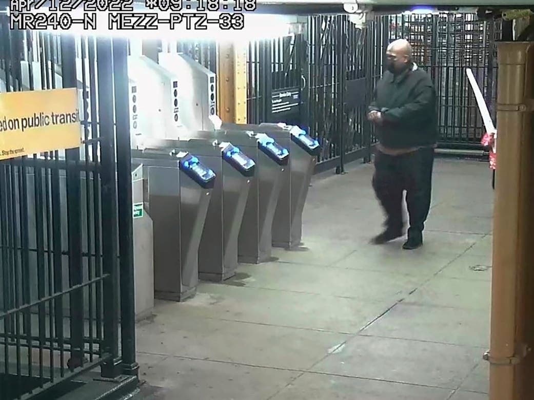 This image provided by New York Police Department shows suspected subway shooter Frank James, 62, leaving a subway station after an April 12 attack on a train.