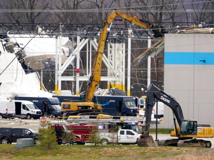 A heavily damaged Amazon fulfillment center is seen Dec. 11 in Edwardsville, Ill. A large section of the roof of the building was ripped off and walls collapsed when strong storms moved through area and killed six people.