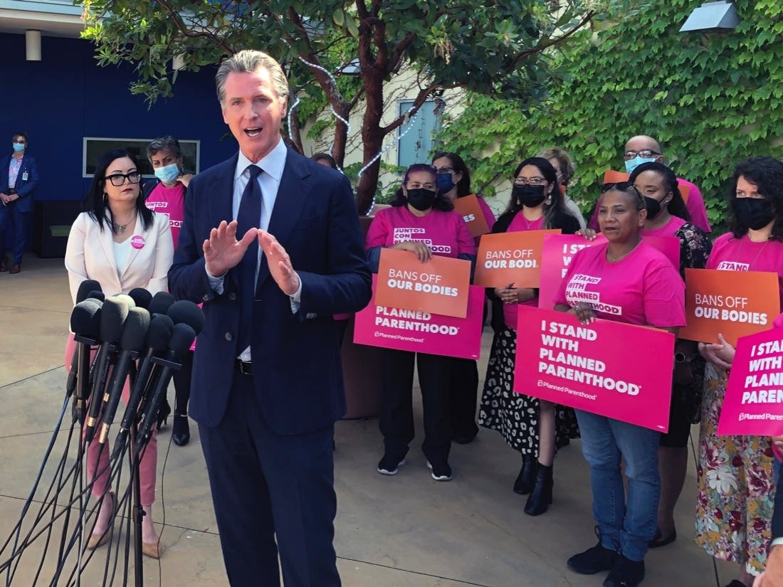 Gov. Gavin Newsom stands outside a Planned Parenthood Center in Los Angeles in a file photo to propose taxpayer money for women who can't afford abortions.