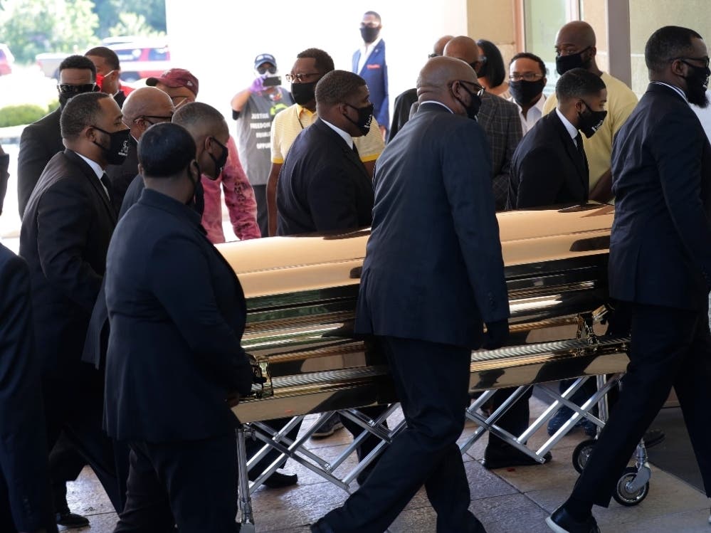 The casket of George Floyd arrives Monday for a public memorial at The Fountain of Praise church in Houston.