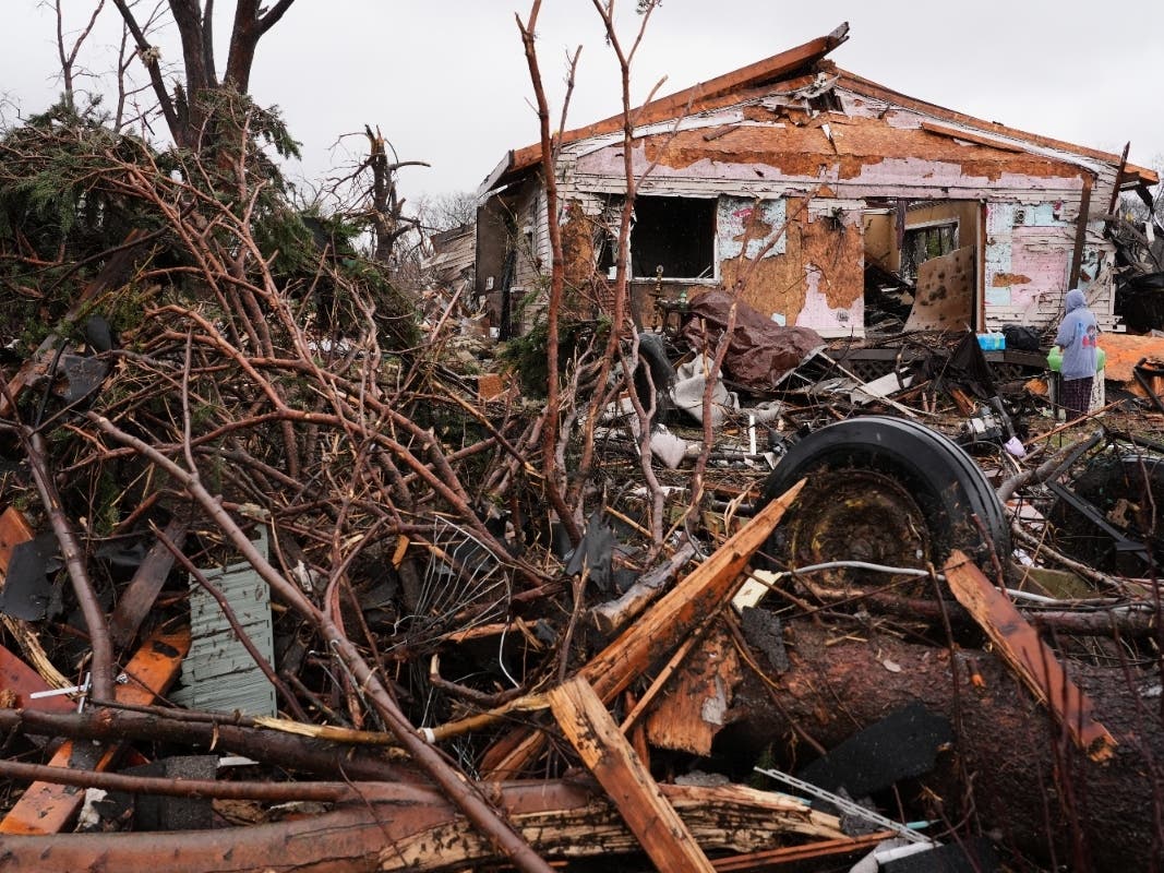 Broken trees and damaged property are among the debris in the aftermath of a powerful storm that ripped through the area in March in Aroma Park.