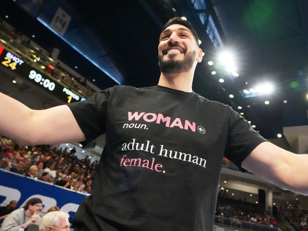 Former NBA center Enes Kanter Freedom greets a friend before a WNBA basketball game between the Indiana Fever and the Chicago Sky on Sunday in Chicago. 