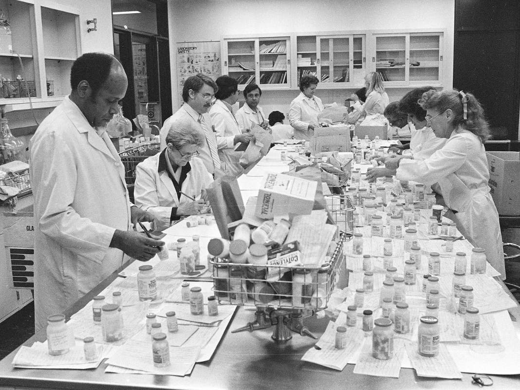 In this Oct. 4, 1982 file photo, Chicago City Health Department employees test Tylenol medicine for cyanide content at a city laboratory in Chicago.