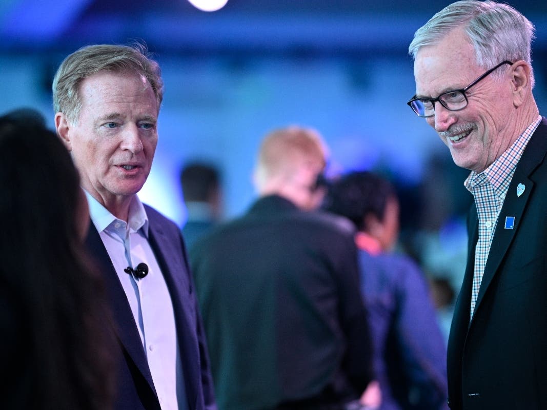 NFL Commissioner Roger Goodell meets with Chicago Bears owner George McCaskey during the 2025 annual league meetings.