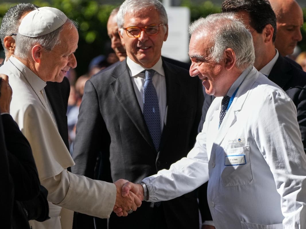 Medical Director Andrea Cambieri, right, greets Pope Leo XIV as he arrives at the Agostino Gemelli Polyclinic in Rome on Tuesday, where doctors operated to remove a lung nodule.