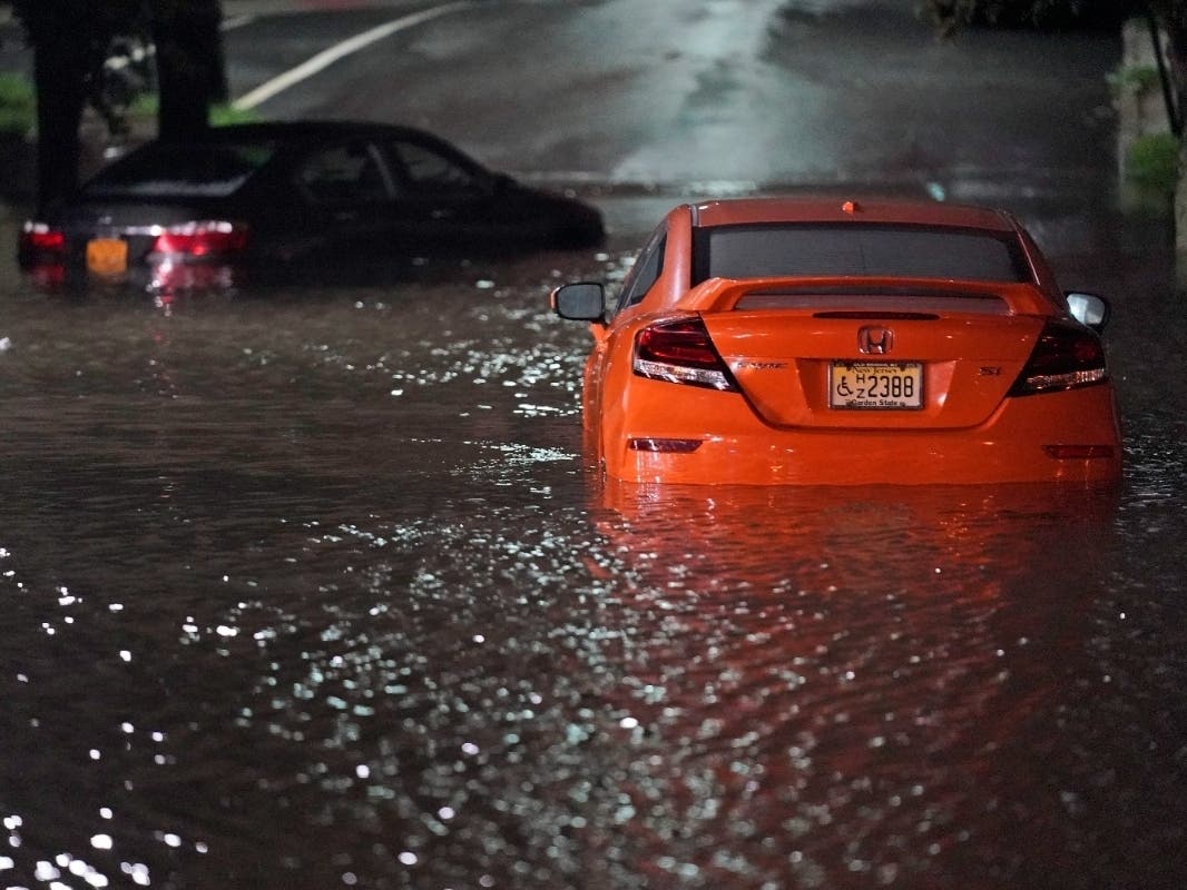 Abandoned cars sit in high water on a road in Lodi, N.J., Thursday, Sept. 2, 2021. 