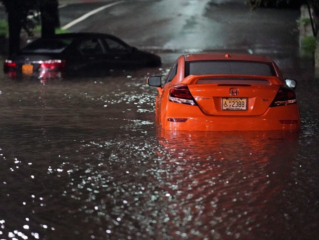Abandoned cars sit in high water on a road in Lodi, N.J., Thursday, Sept. 2, 2021.