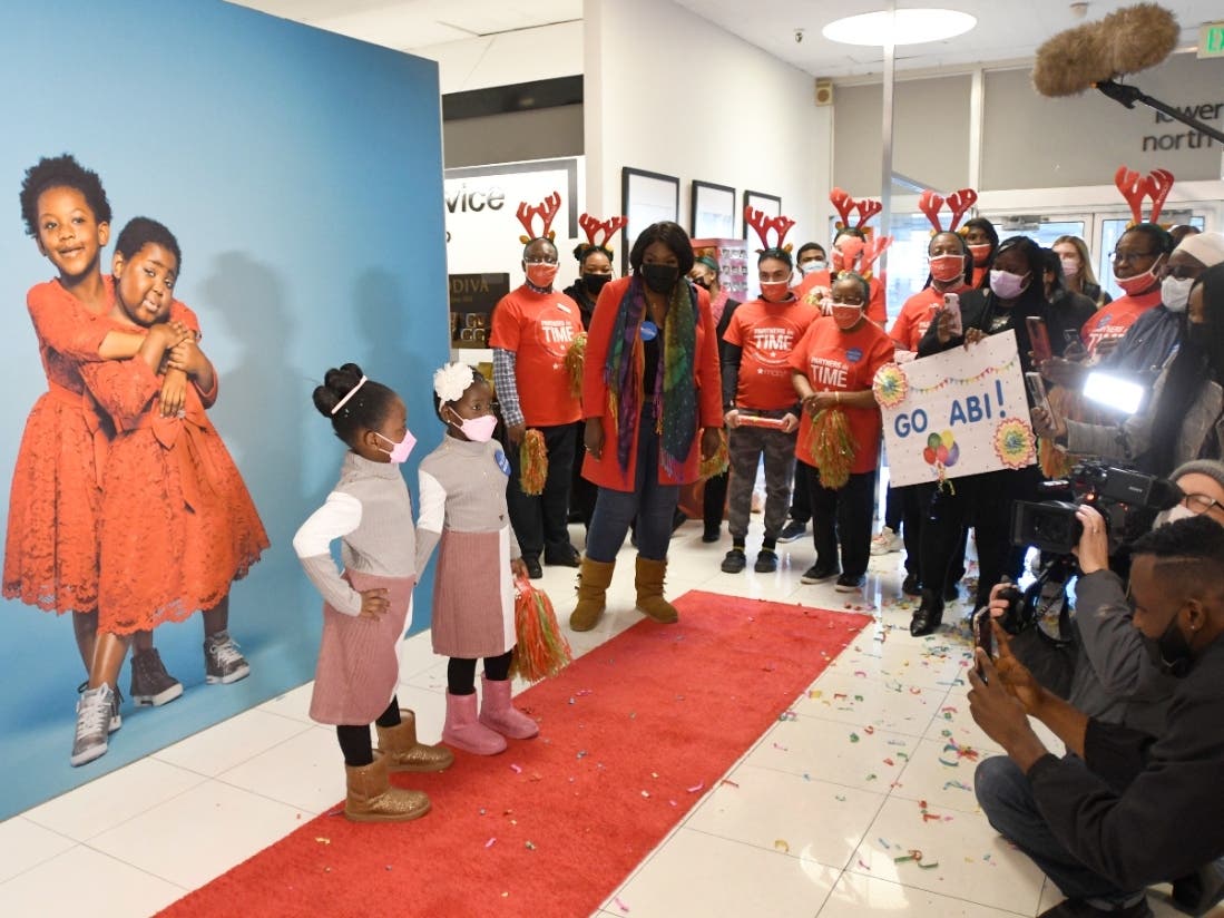 Abi and her twin sister Vivi pose for pictures at a VIP experience at Macy's in the Mall at Prince George's.
