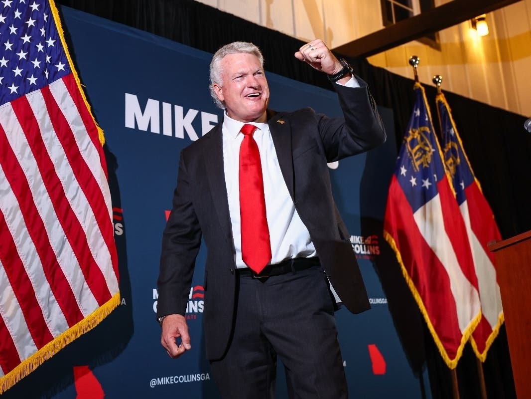 U.S. Senate candidate Mike Collins celebrates during an election-night watch party after winning the Republican nomination,