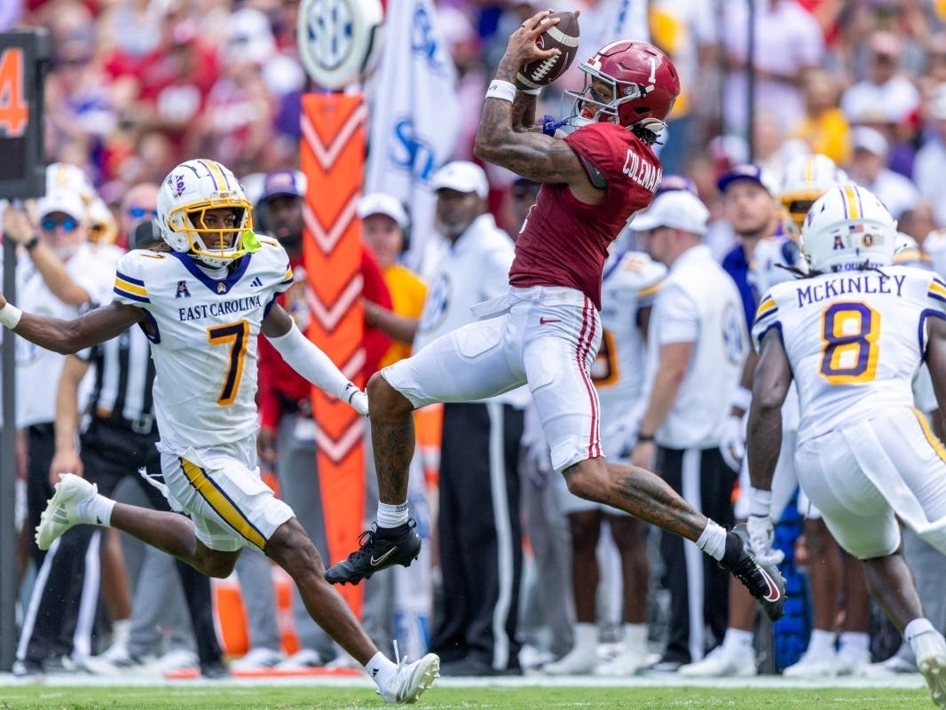 Alabama wide receiver Ryan Coleman-Williams (1) leaps for a catch between of East Carolina defensive backs Ashton Levells-Mitchell (7) and Kamaurri McKinley (8) during the first half of an NCAA college football game Saturday, Sept. 5, 2026, in Tuscaloosa,