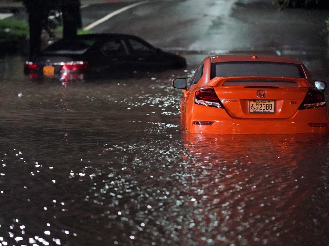 Abandoned cars sit in high water on a road in Lodi, N.J., Thursday, Sept. 2, 2021. 