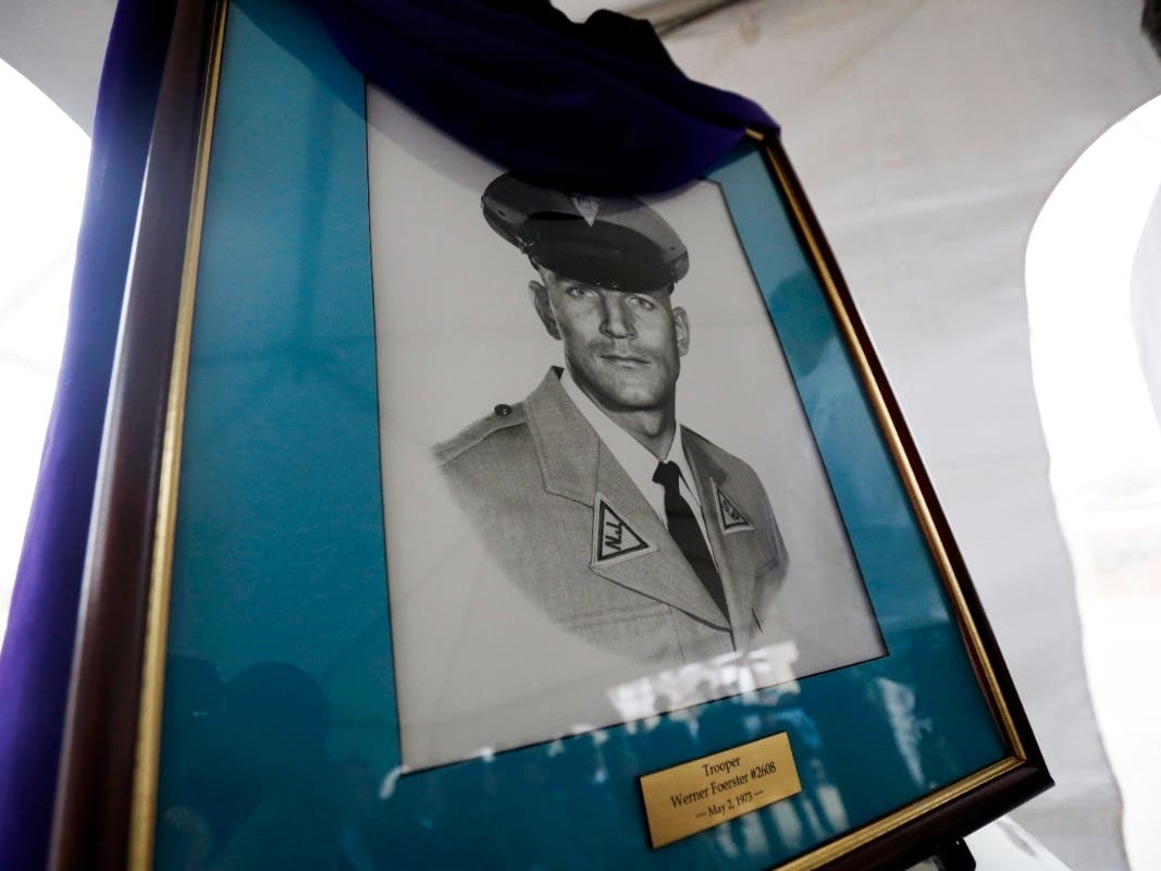 A portrait of New Jersey State Police trooper Werner Foerster is displayed during an event unveiling a monument in his honor, Nov. 18, 2015, in East Brunswick, N.J. 