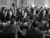 This image released by Universal Pictures shows Cillian Murphy, center, in a scene from "Oppenheimer."