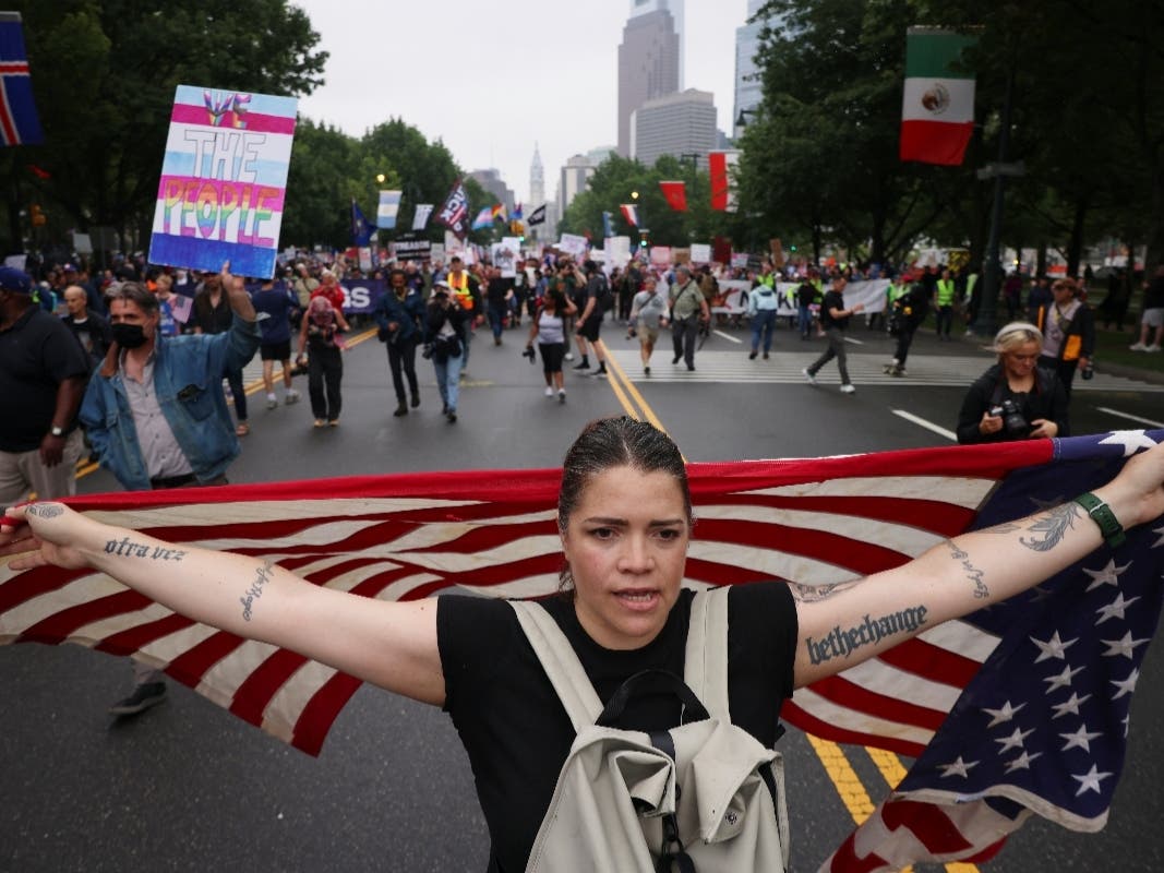 Demonstrators march down Benjamin Franklin Parkway during the "No Kings" protest, June 14, 2025, in Philadelphia.