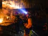 Firefighter monitor the advance of the CZU August Lightning Complex Fire in the backyard of a home Friday, Aug. 21, 2020, in Boulder Creek, Calif. 