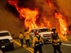 Flames from the LNU Lightning Complex fires leap above Butts Canyon Road on Sunday in unincorporated Lake County, Calif. 