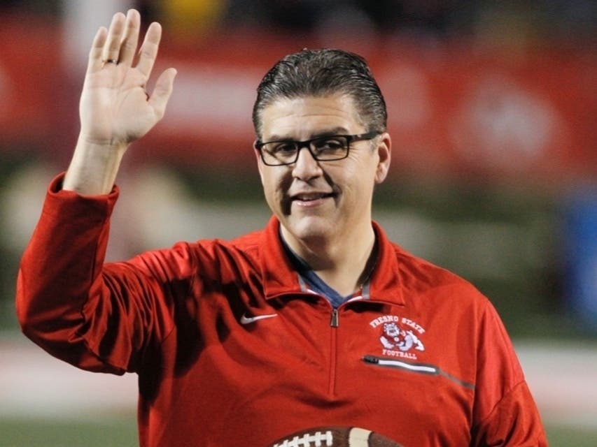  In this Nov. 4, 2017 file photo, Fresno State president Joseph I. Castro waves to the crowd before an NCAA college football game against BYU in Fresno, Calif. Castro was chosen to be the new chancellor of the California State University.