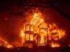 Flames from the Glass Fire consume the Glass Mountain Inn, late Sunday, Sept. 27, 2020, in St. Helena, Calif. 