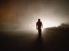 Tom Smith walks on Platina Road after refusing to evacuate Sep. 27 from the Zogg Fire near Ono, Calif.