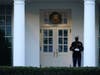 A Marine guard stands at the entrance to the West Wing of the White House, signifying that President Donald is in the Oval Office, while impeachment proceedings are going on in the U.S. Capitol against Trump in Washington, Tuesday, Jan. 12, 2021. 