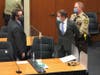 Former Minneapolis police Officer Derek Chauvin, center, is taken into custody as his attorney, Eric Nelson, left, looks on.