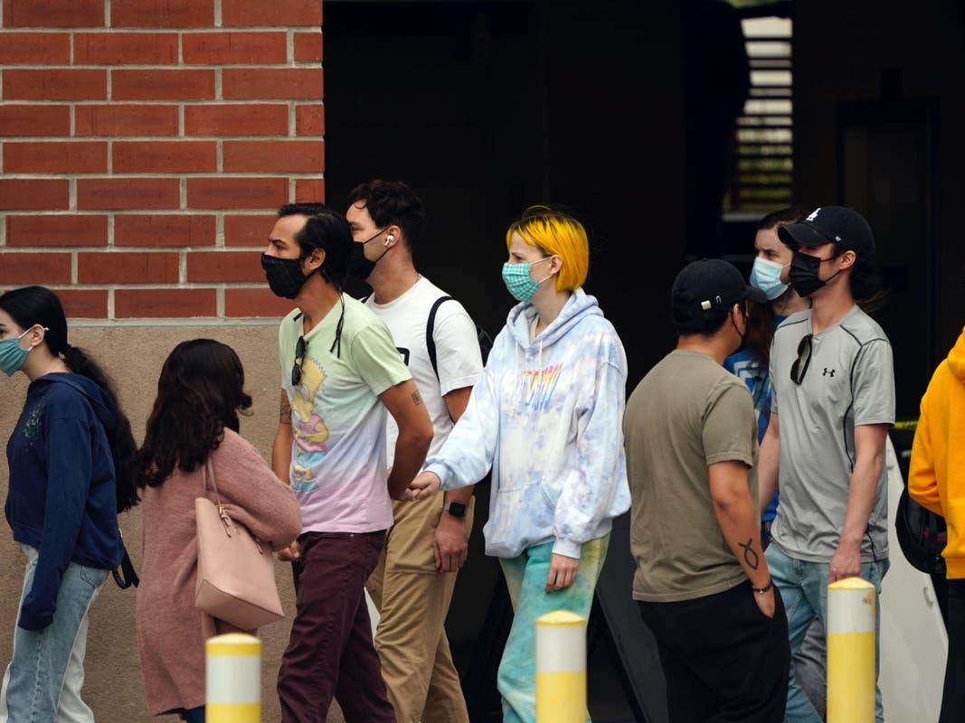 People line up to receive a COVID-19 vaccine Tuesday, April 13, 2021, on the campus of Cal State LA in Los Angeles. 