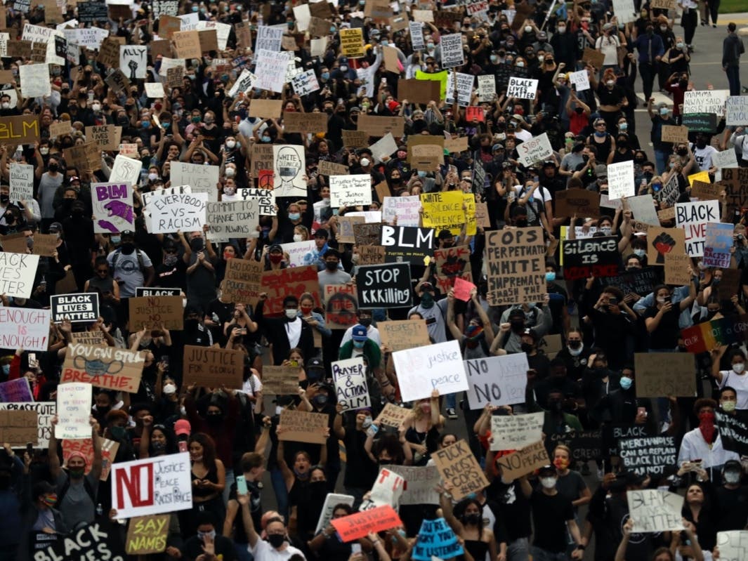 Protesters march Thursday, June 4, 2020, in San Diego. Protests were held in U.S. cities, sparked by the death of George Floyd, a black man who died after being restrained by Minneapolis police officers on May 25. 