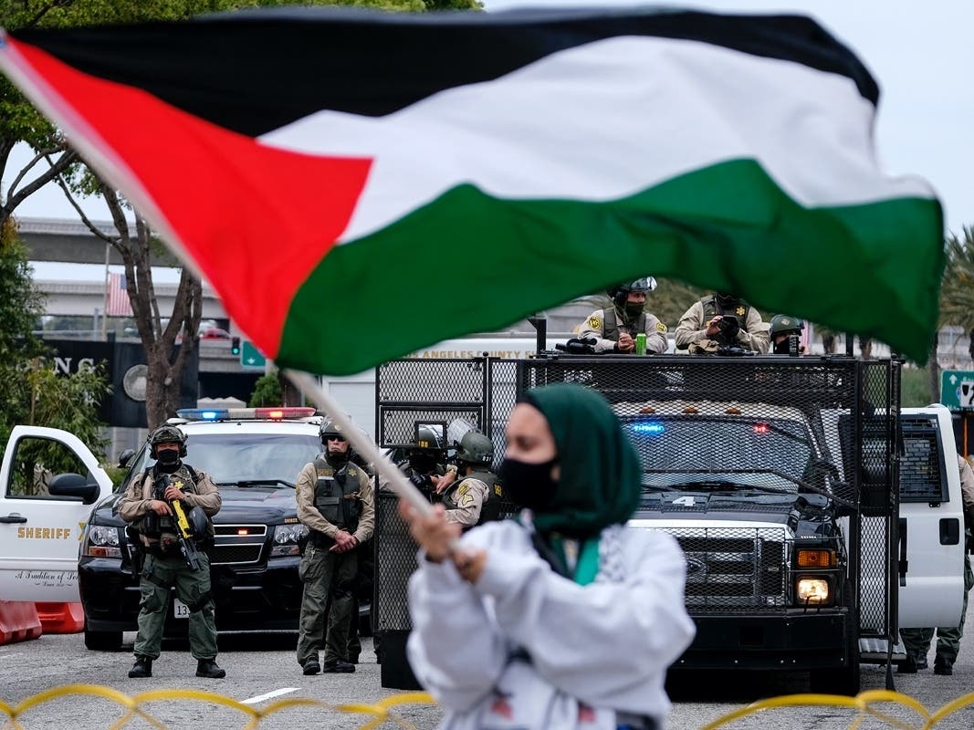 Police officers guard outside the Federal Building during a protest against Israel and in support of Palestinians, Saturday, May 15, 2021, in the Westwood section of Los Angeles. 