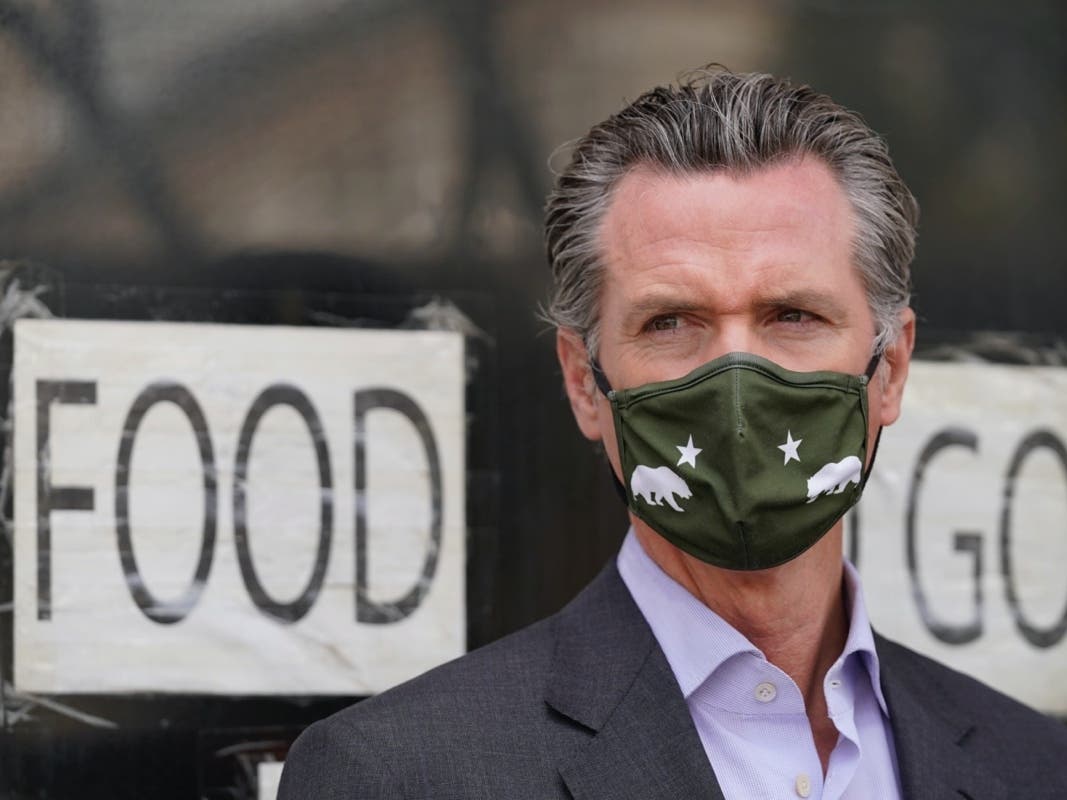 California Gov. Gavin Newsom waits to speak at a news conference about relief for restaurants outside Tommy's Mexican Restaurant in San Francisco, on Thursday, June 3, 2021. 