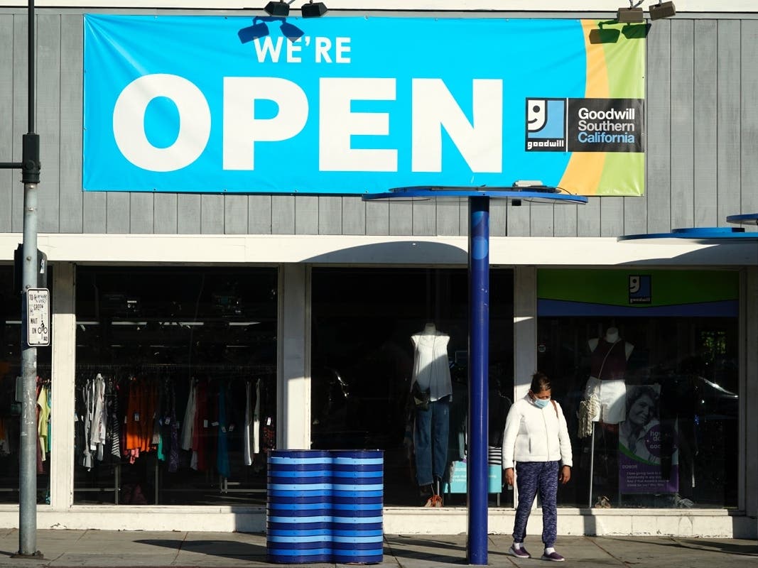 A sign announces that a Goodwill store is open amid the coronavirus pandemic in Santa Monica in this file photo.