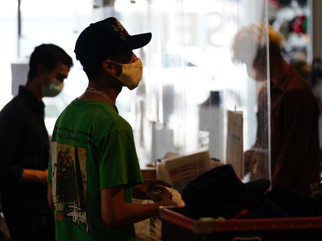 In this July 19 2021 file photo, employees check out customers at 2nd Street second hand store in the Fairfax district of Los Angeles. 
