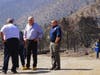Nevada Gov. Steve Sisolak, second from left, tours areas of the forest damaged by wildfires near where the Tamarack Fire ignited earlier in July in Gardnerville, Nev., Wednesday, July 28, 2021.