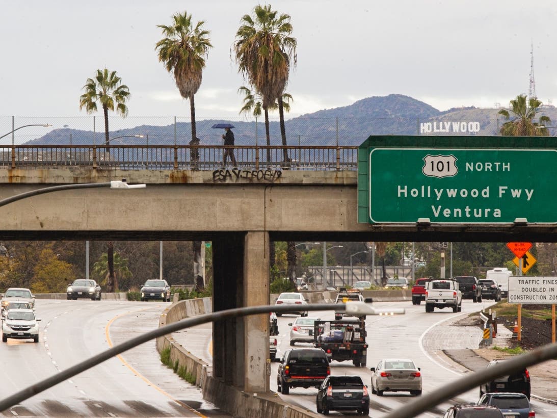 The Hollywood sign is vewed from downtown Los Angeles after heavy rains early Friday, April 10, 2020.
