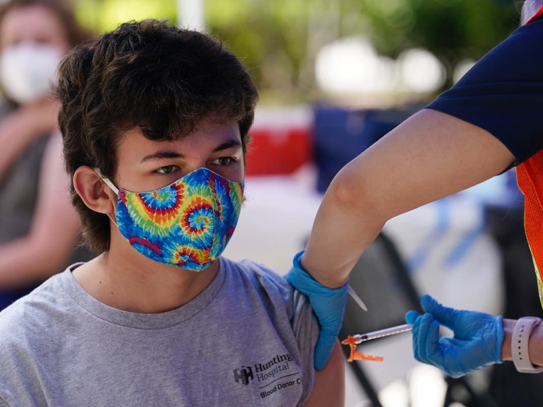 Finley Martin, 14, gets a shot of the Pfizer COVID-19 vaccine at the First Baptist Church of Pasadena Friday, May 14, 2021, in Pasadena, Calif.