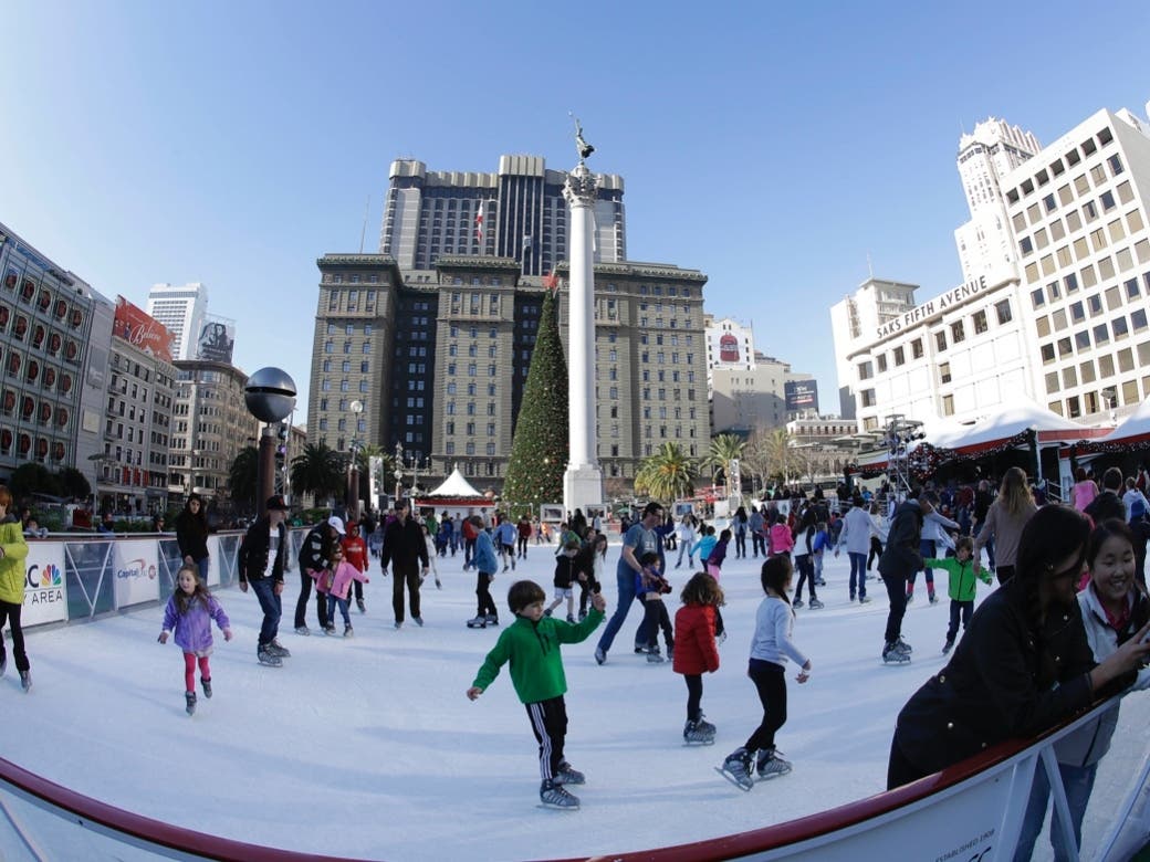 In this photo taken with a fisheye lens, skaters use the Union Square Holiday Ice Rink in San Francisco, Tuesday, Dec. 24, 2013. 